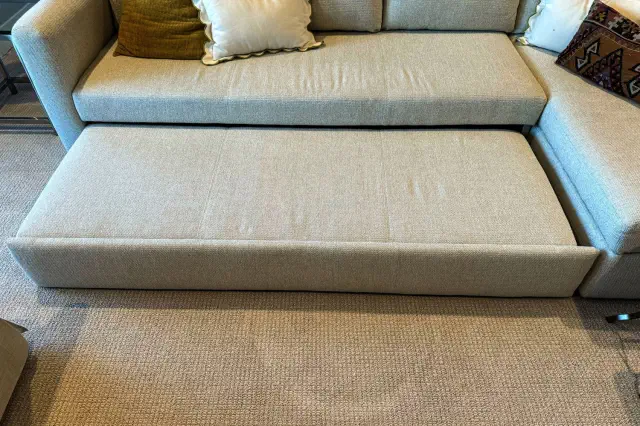 The Room & Board 90 Inch Pop-Up Platform Queen Sleeper Oxford Sectional with the sleeper extended
