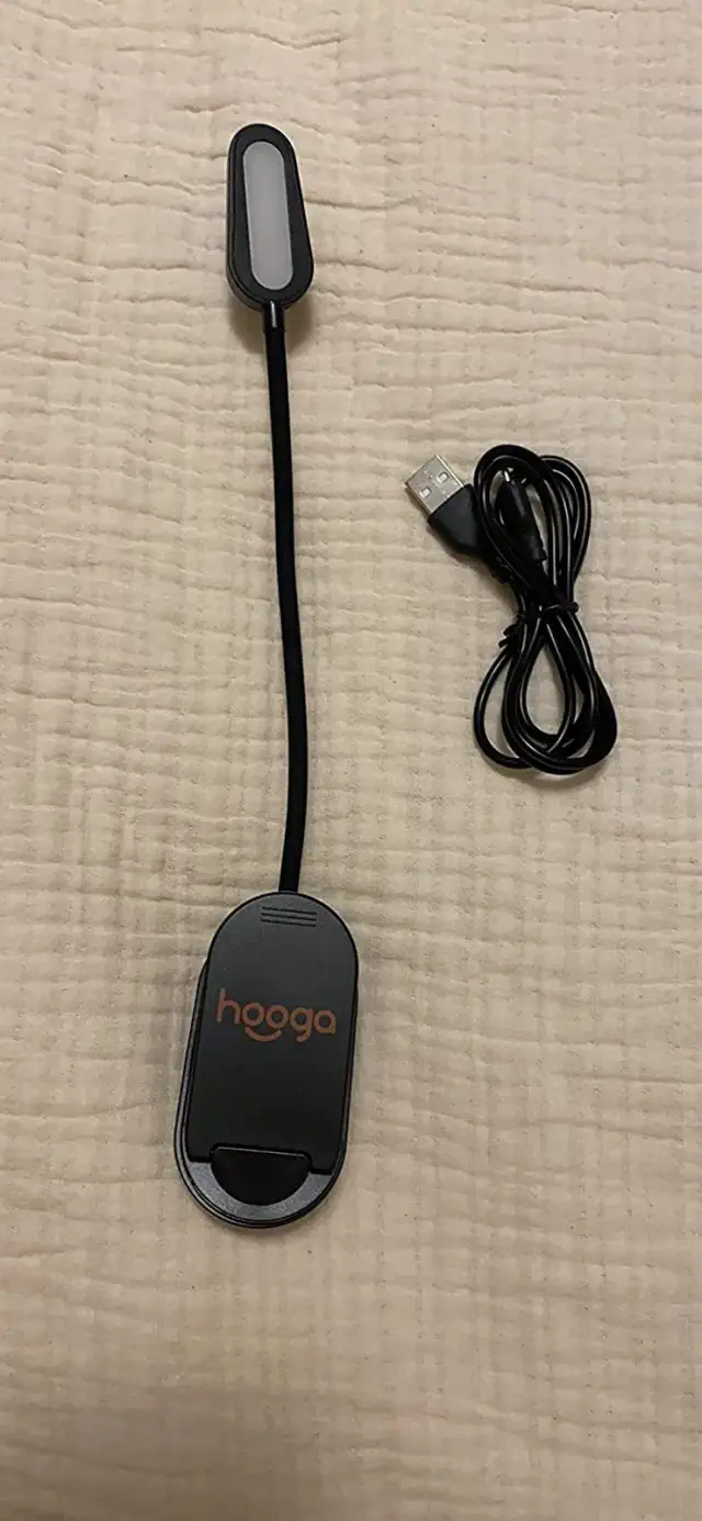 an amber clip on light shown with the charger