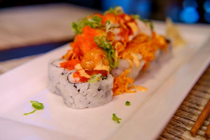 Beautiful spicy special Volcano sushi roll with crab meat and spicy mayonnaise