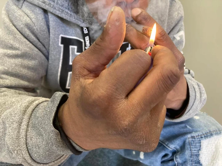 A middle-aged man smokes crack cocaine in Rhode Island. The...