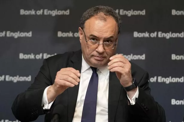 Bank of England holds interest rates as it slashes UK growth forecasts to zero