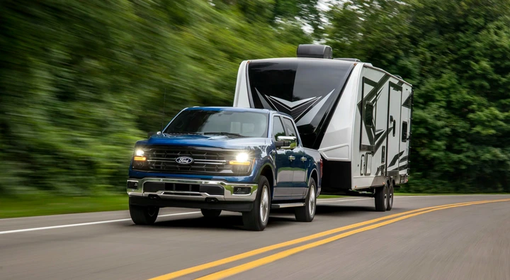 The 2024 Ford F-150 Hybrid pulling a camper