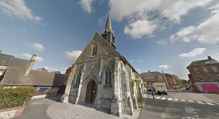 Stone church with a steeple in the small French town of Lieurey, Thiberville in Normandy, which received a large bequest.