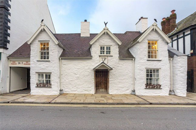 The Grade-II* listed building in Conwy, North Wales. Photo release January 8 2025. A quirky building with a bathtub in the shape of a high-heeled shoe and only a short walk away from a castle is on the market. A Grade-II* listed building in Conwy, North Wales, with several unusual features is available for ?875k.The property dates back to the 16th century and is situated within the walled section of the town. A big pink and purple high-heeled shoe serving as a bathtub and a sink shaped like a mug are some of the