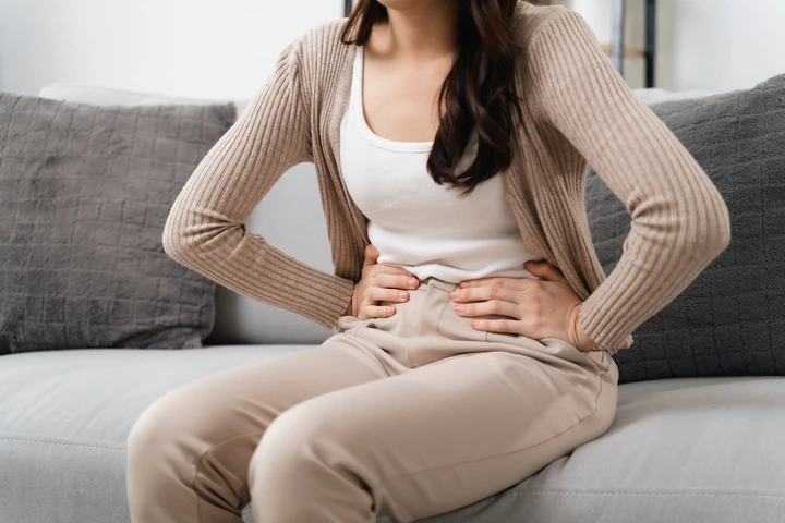 Woman with stomach pain