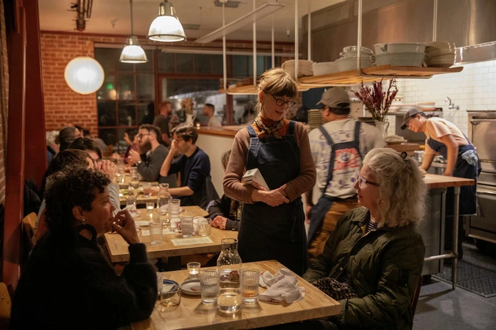 Kelsie Kerr, the chef and owner of Regular Menu, chats with regular diners Kathy Batt, right, and Maya Mosley in Berkeley, Calif., on Friday, Jan. 03, 2025.