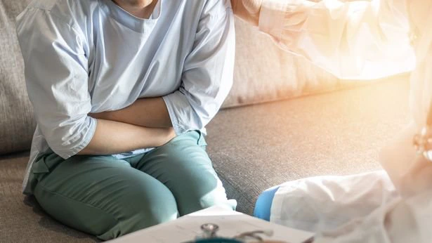woman holding tummy