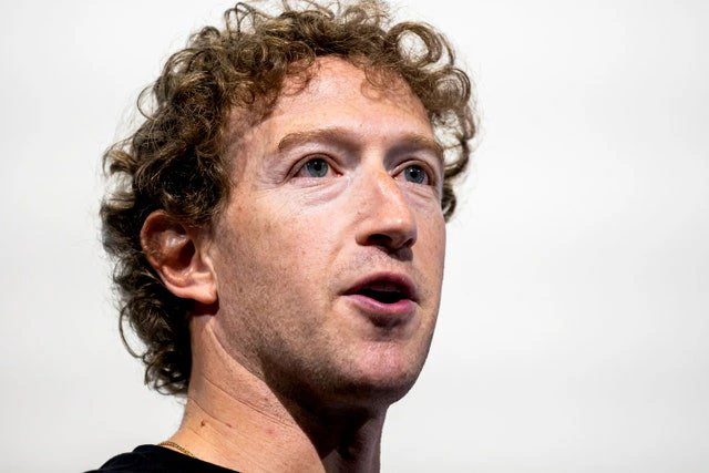 Image may contain: Mark Zuckerberg, Head, Person, Face, Photography, Portrait, Adult, Body Part, Neck, and Accessories