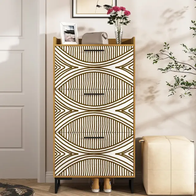 Modern patterned dresser with unique geometric design, adorned with a photo frame and a vase of flowers, next to a beige ottoman in a stylish room