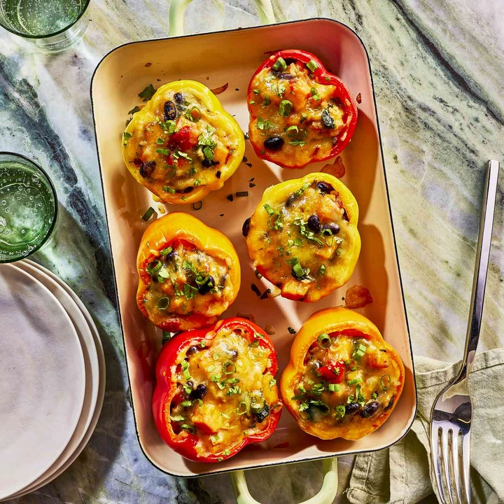 Image of Sweet Potato & Black Bean Stuffed Peppers in a baking dish 