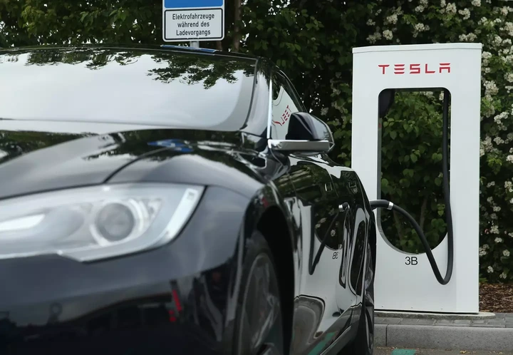 Electric car charging stations are available, yet the majority of users will likely find themselves charging their vehicles at home. (Sean Gallup/Getty Images)