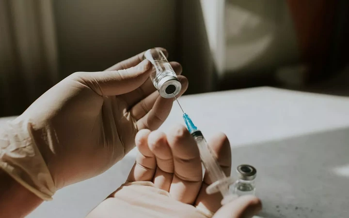 Medical professional preparing a vaccine injection