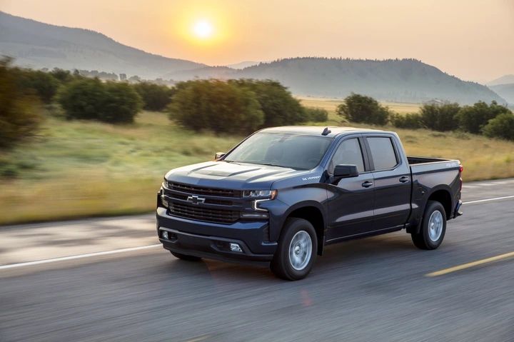 A 2020 Chevy Silverado on the road at sunrise