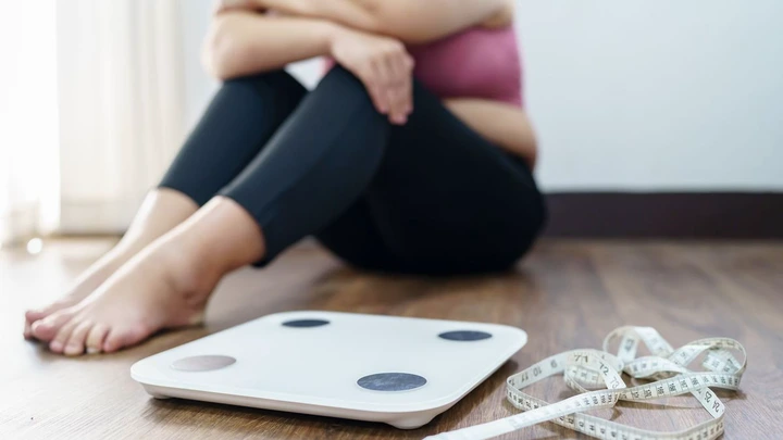 Person upset with their BMI measurements