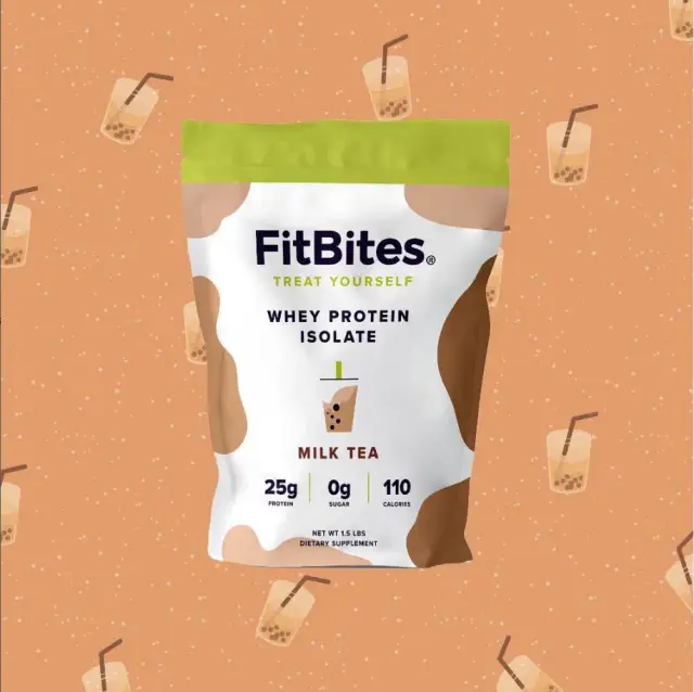 FitBites Whey Protein Isolate Milk Tea flavor is displayed against a backdrop featuring milk tea illustrations. The packaging highlights 25g protein, 0g sugar, and 110 calories