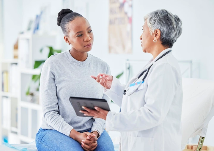 Woman talking to a doctor