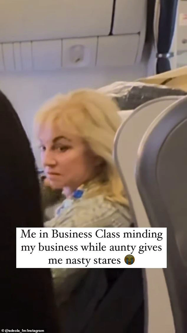 A passenger on the flight appeared to be irritated with another woman who was filming herself while brushing her hair.