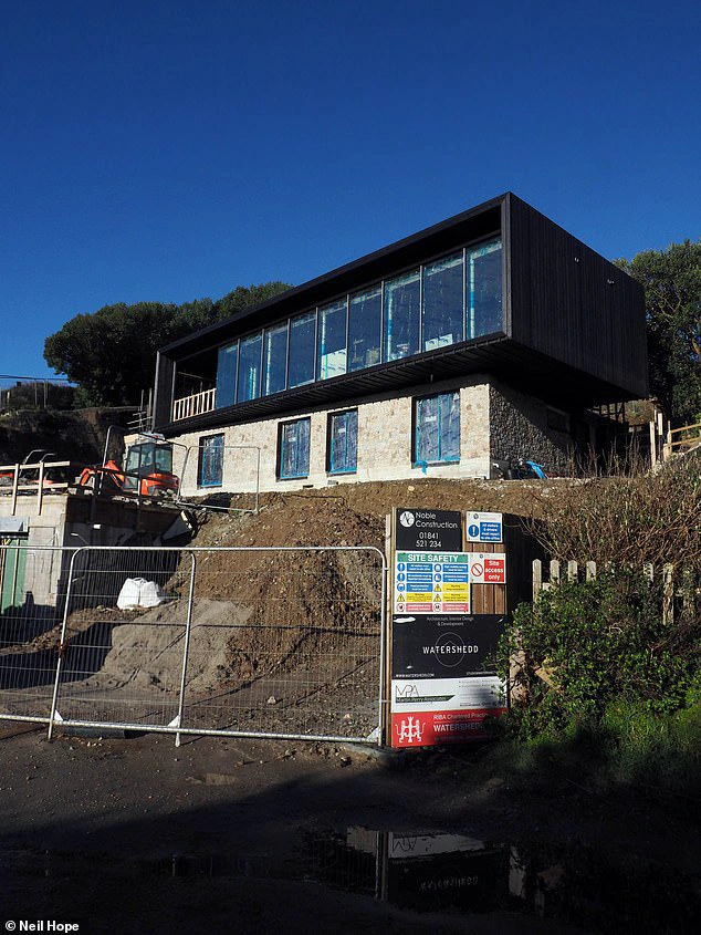 The unusual residence, resembling a shipping container, is said to be priced at £5 million.