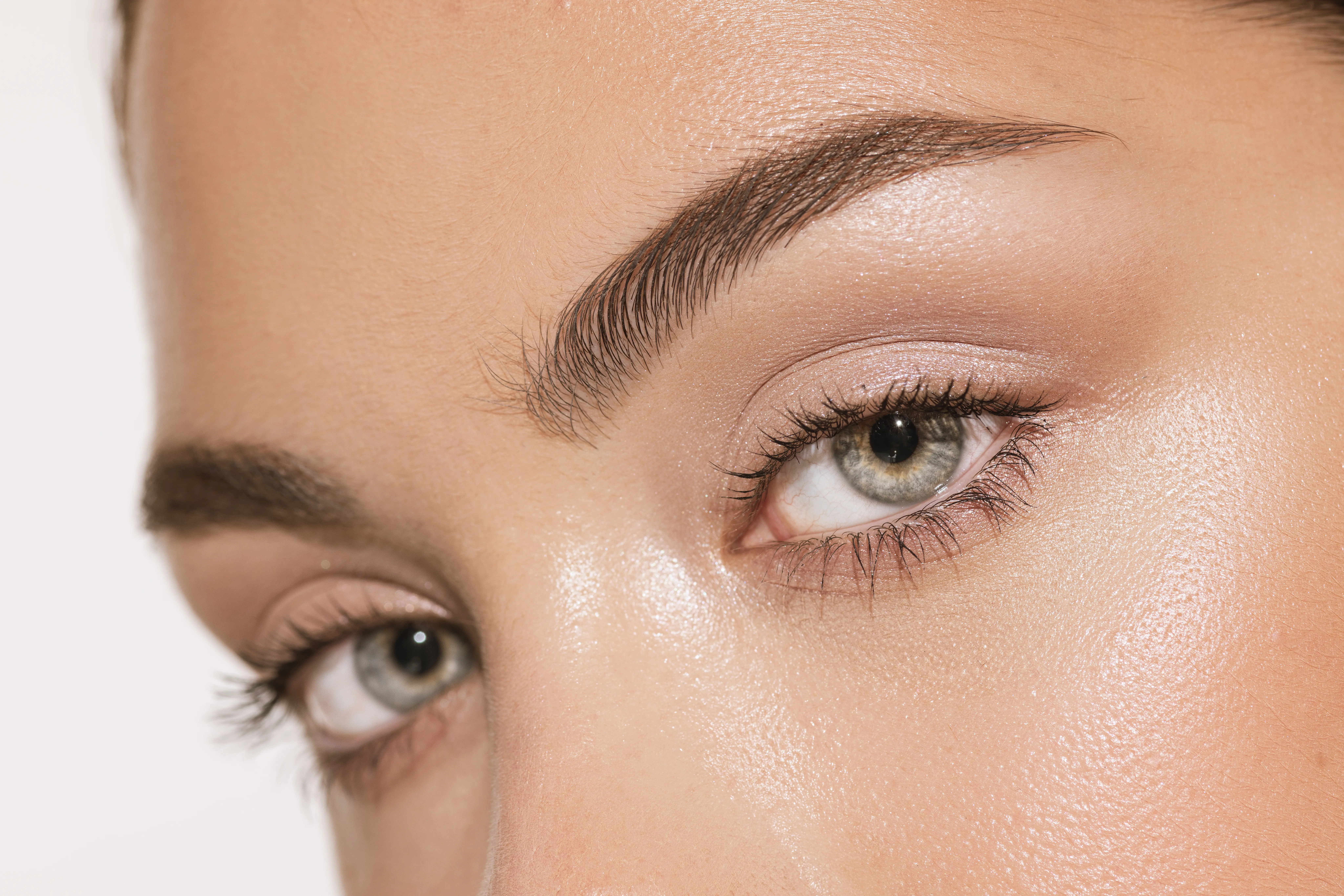 Grey eyes and perfect shapes of eyebrows. 