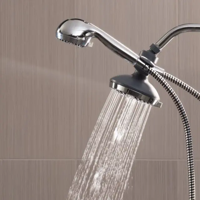 Showerhead with adjustable spray, showing water flow. Featured in a shopping article, likely promoting bathroom essentials