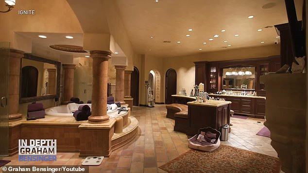 This spacious bathroom features a large hot tub and a cozy seating area, creating a luxurious atmosphere.