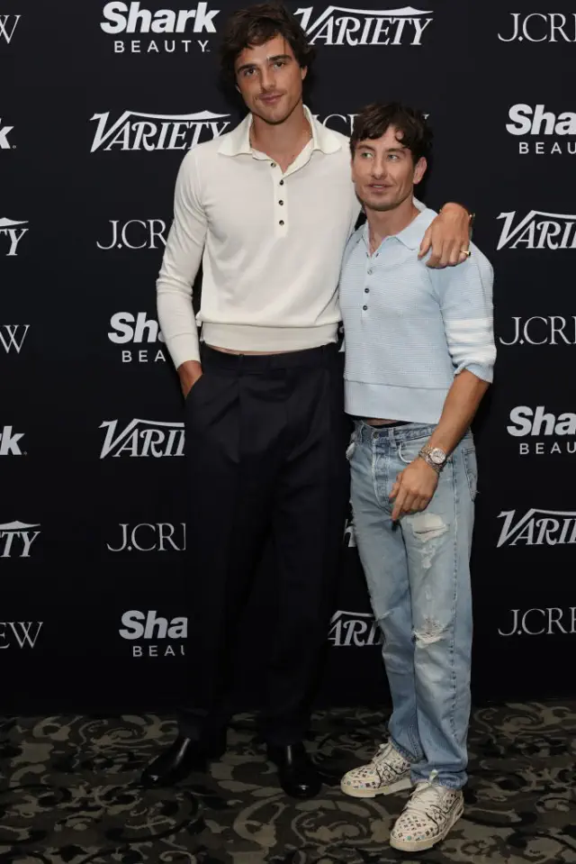 Jacob and Barry pose for photos at a Variety event; Jacob wears a collared shirt and trousers, Barry sports a casual sweater and ripped jeans. Barry comes up to Jacob&#x27;s jaw