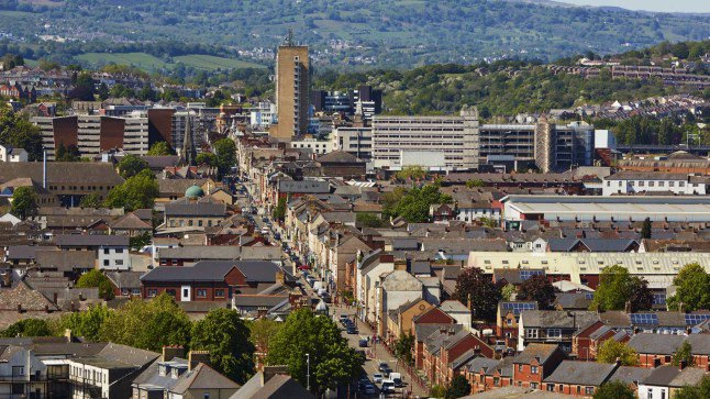 Aerial view of terraced housing in the centre and skyline of Newport in South Wales