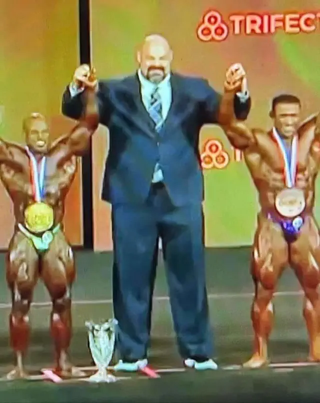 Brian Shaw posing with bodybuilders