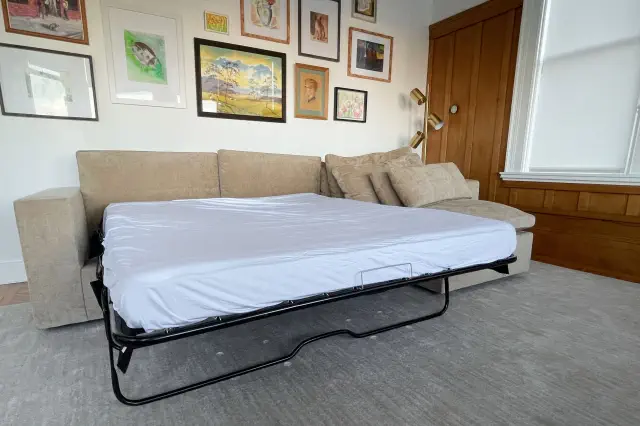 West Elm Harmony Modular 2-Piece Sectional with bed pulled out in living room