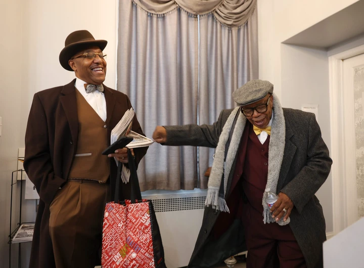 On November 23, 2024, in Chicago, James 40X shares a laugh with Wilbur Muhammad following the delivery of bean pies for a funeral repast. (Photo by John J. Kim/Chicago Tribune)