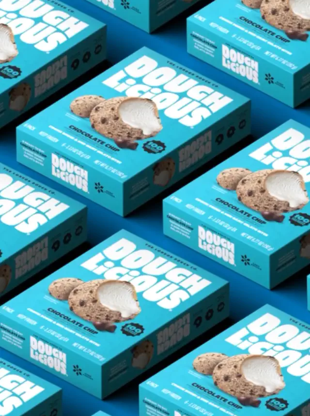 Boxes of Doughlicious chocolate chip cookie dough are arranged in a pattern, showcasing the packaging and branding
